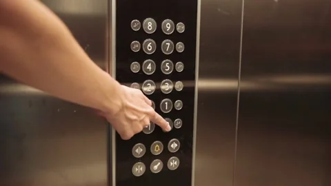 Woman push button in elevator Stock Footage 165385859