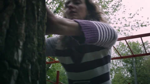 Woman pushes off a tree. 스톡 동영상 139084516