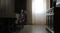 woman pushes a wheelchair with a handicapped man, talk to him and try to comfort HD Footage