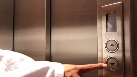 Woman Pushing the Button on the Elevator Panel 動画素材 111698007
