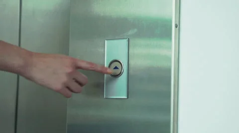 Woman pushing elevator button Stock Footage 63305952
