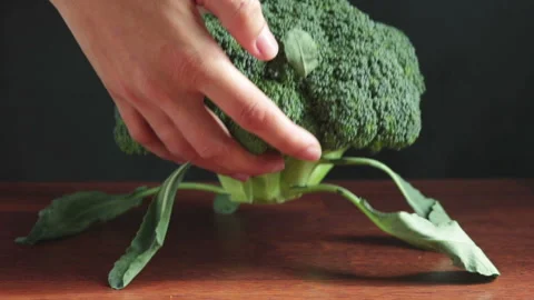 Woman put broccoli on the table Stock-Footage 103845897