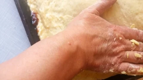 The woman put the dough on a baking sheet Stock Footage