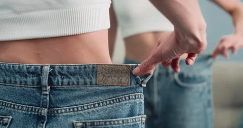 Woman in Underwear Trying To Put on Her Jeans Shorts in Front of the  Mirror. Stock Footage - Video of stuck, small: 274851436