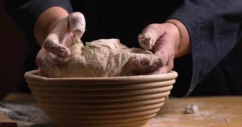 Woman puts bread dough in a baking basket Stock Footage 254690793