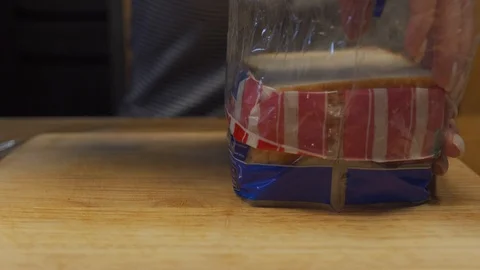 Woman puts bread on a table Stock Footage 102982616