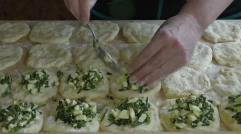 Woman puts on the dough stuffing Video stock 54303603