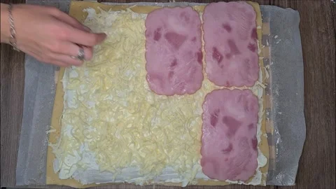 Woman Puts Ham On Cheese While Making Roll. Video stock 220727732
