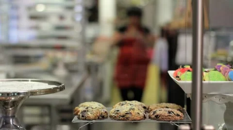 Woman puts pie on display at a bakery Stock Footage