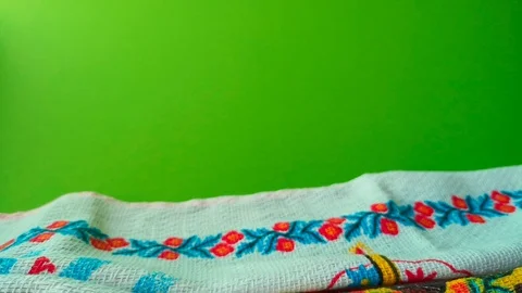 Woman puts a wicker plate with Easter eggs, green screen background. Stock Footage 105926209