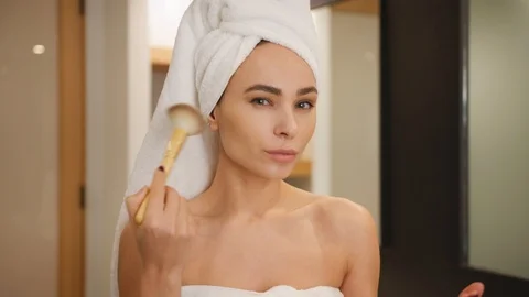 Woman putting makeup on using brushes Stock Footage 101483528