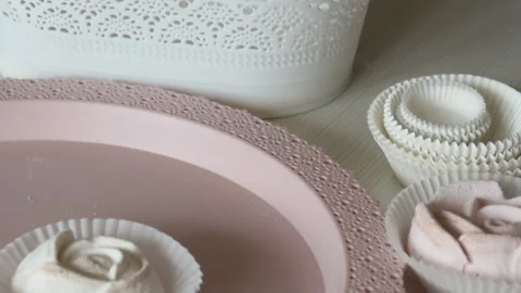 A woman is putting marshmallows in a crafted second package. Homemade zephyr  Stock Footage 159350648
