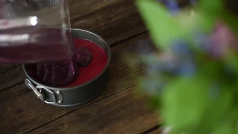 Woman putting third layer of raw vegan ice cream cake Stock Footage 74660705