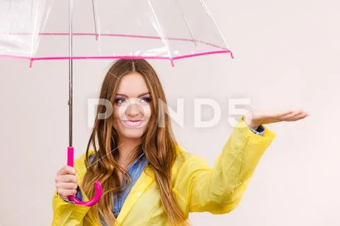 Woman in rainproof coat with umbrella. Forecasting Stock Photos