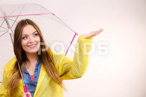 Woman in rainproof coat with umbrella. Forecasting Stock Photos