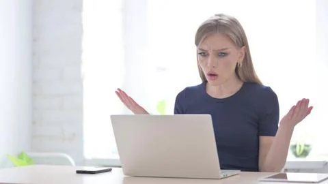 Woman Reacting to Loss While using Laptop Stock Photos
