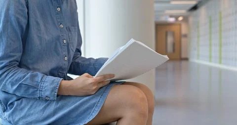Woman read on the note at school Stock Footage 104286291