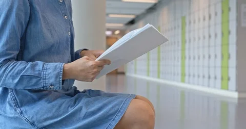 Woman read a note at school Stock Footage 104350501