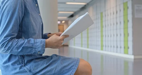 Woman read on the note at school Stock Footage 104397477