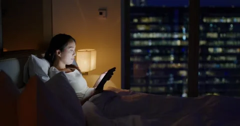 Woman read on the tablet computer on bed at night Video stock 160718591