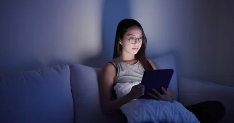 Woman read on tablet computer in the evening Video stock 254288638