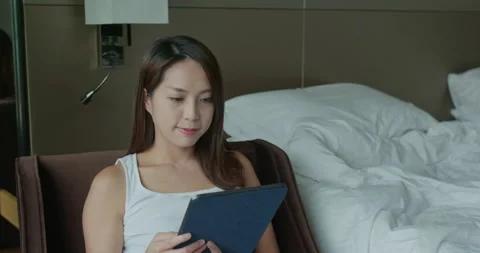 Woman read on tablet computer at home Video stock 145209624