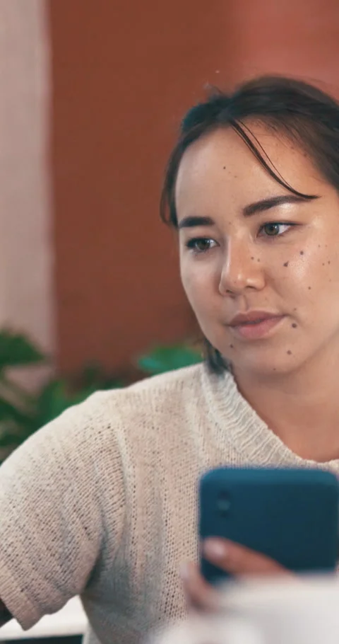 Woman, reading and remote work in home with phone, computer and check website Stock Footage 329757808