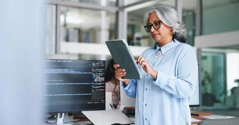 Woman, reading and tablet for programming in office for research, software .. Foto stock