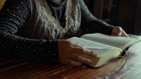 A woman reading a a book bible using hand close up Vídeo Stock 278314322