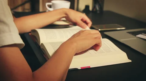 Woman reading book Stock Footage 64779057