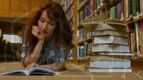 Woman reading book while lying on the ground Stock-Footage 104921463
