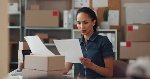 Woman, reading documents and boxes of startup for stock checklist, inventory Stock Footage 300661677