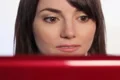 Woman reading laptop. Wide. SD. Footage
