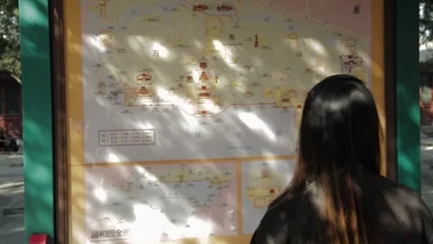 Woman Reading Map Board at Summer Palace Beijing Outdoors in Sunlight Stock Footage 341780153