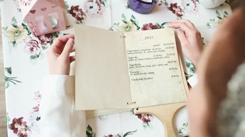 Woman reading the menu Stock Footage 36469367