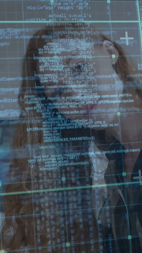 Woman reading screen at desk, programming HUD gaining opacity and guiding head 動画素材 333006438
