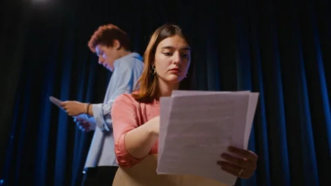 Woman Reading Script during Acting Rehearsal in Student Theater Stock Footage 344522149