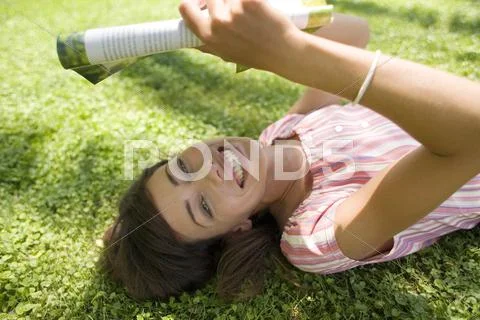 Woman reading in the shade Stock Photos