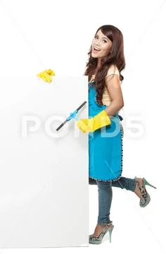 Woman ready to do a domestic chores. standing next to white blan Stock Photos