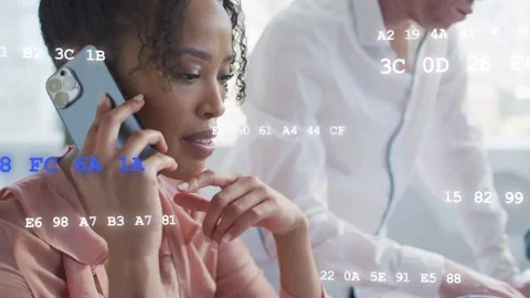 Woman receiving call, coordinating tech and typing as animated code drifting Stock Footage 333975492