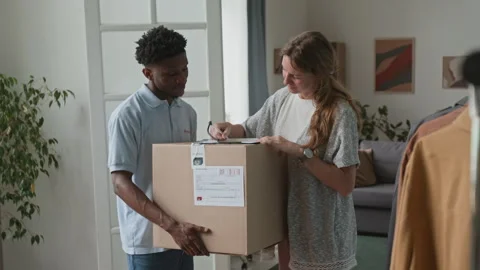 Woman Receiving Parcel Video stock 316599384