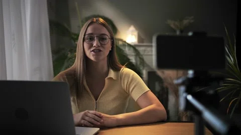 Woman record online lesson using smartphone in home interior.Young blonde hair Stock Footage 209828179