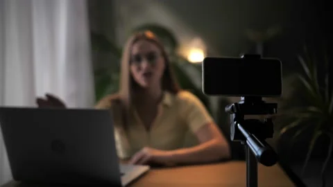 Woman record online lesson using smartphone in home interior.Young blonde hair Stock Footage 209828275