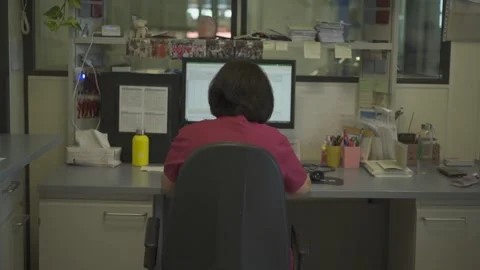 Woman in red coat in front of the computer in a food laboratory Stock Footage 278271441