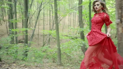 Woman In Red Dress Running Away In Forest Stock Footage