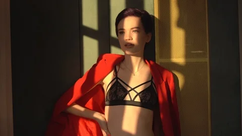 The woman in the red jacket 스톡 동영상 102779382