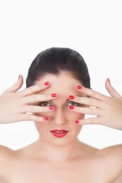 Woman with red lips and red painted finger nails over face Stock Photos