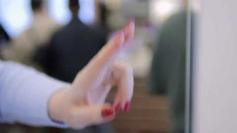 Woman with red nails is pointing at a screen Stock Footage 298514840
