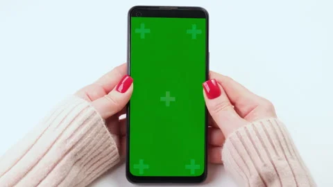 Woman with red nails using green screen chroma key phone in vertical position Stock-Footage 271066352