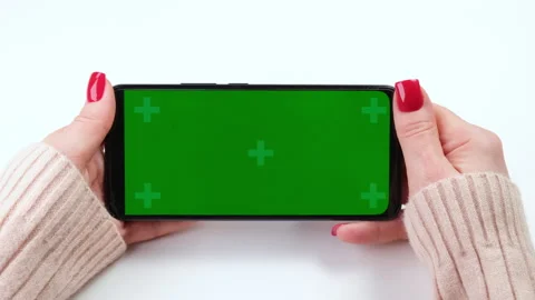 Woman with red nails using green screen chroma key smartphone in horizontal Stock-Footage 273661284